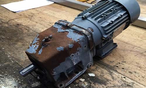An old aluminium gearbox with motor
